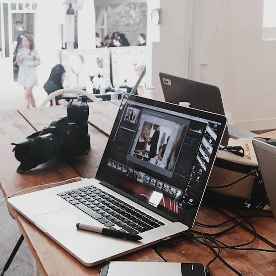 Turned-on Gray Laptop Computer on Table